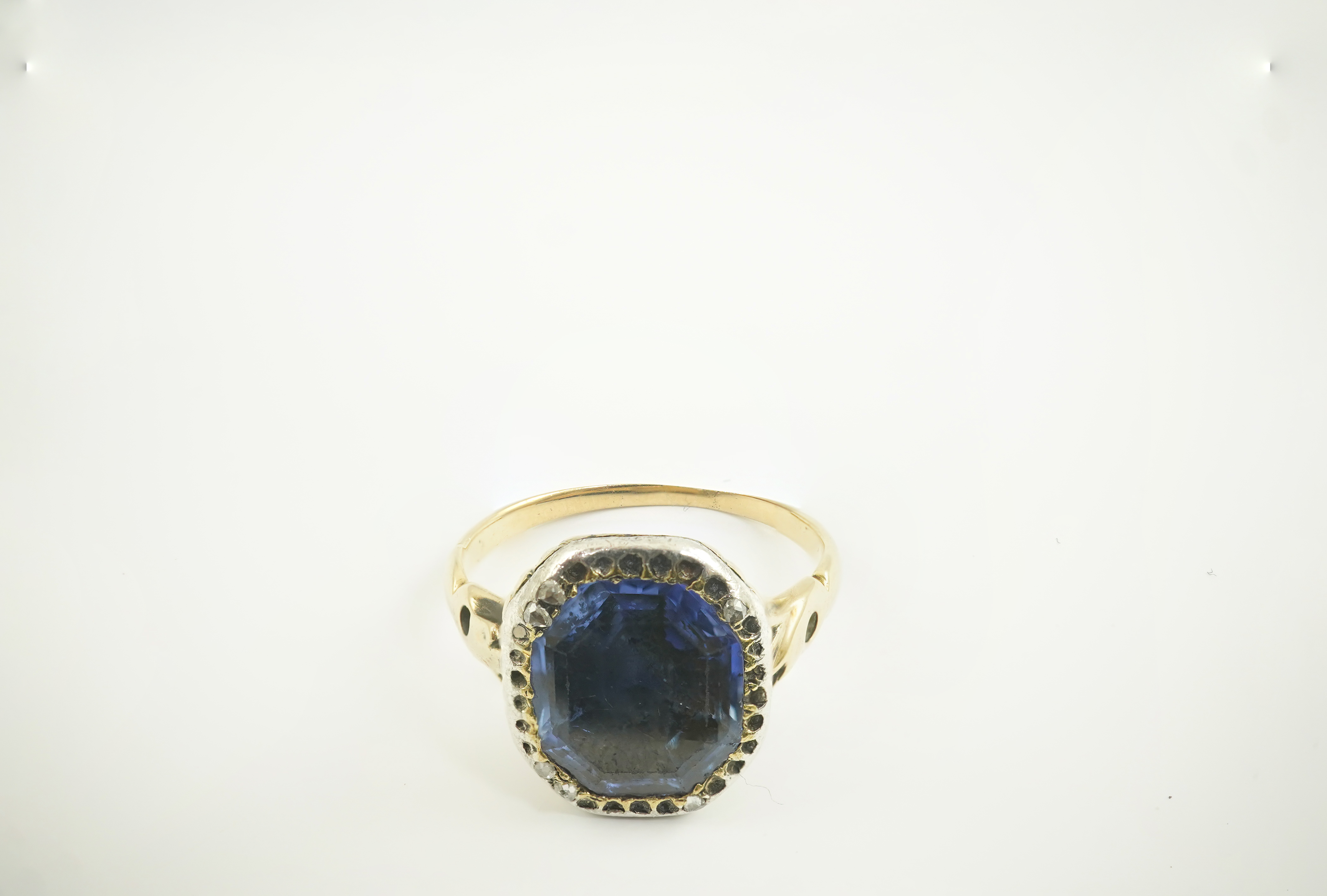 A Georgian gold and single stone collet set octagonal cut sapphire set ring